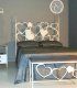 Dormitorio moderno en forja Amore