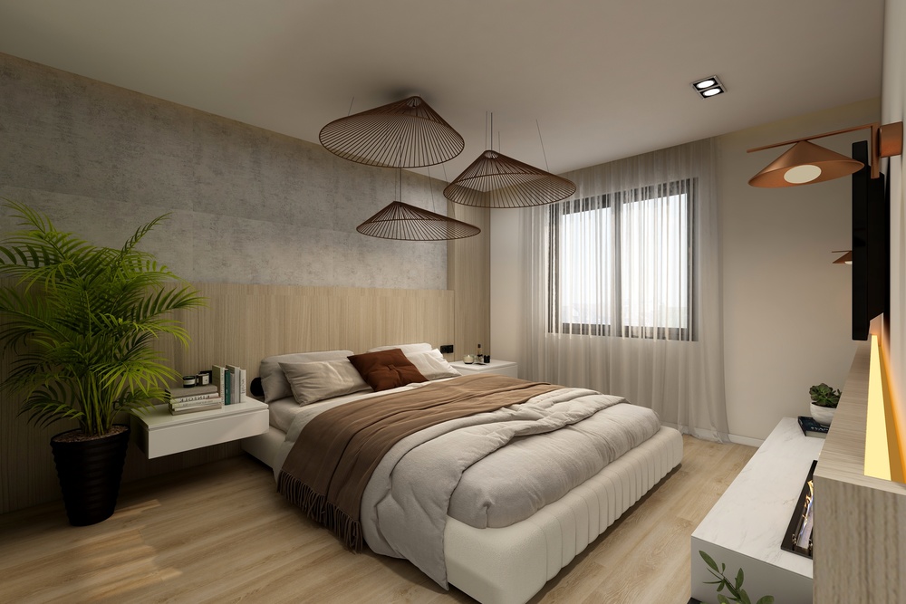 Elegante dormitorio contemporáneo que destaca por su cama espaciosa y cómoda, iluminación suave de lámparas colgantes, y detalles decorativos que crean un ambiente relajante. Ideal para un descanso reparador y revitalizante.